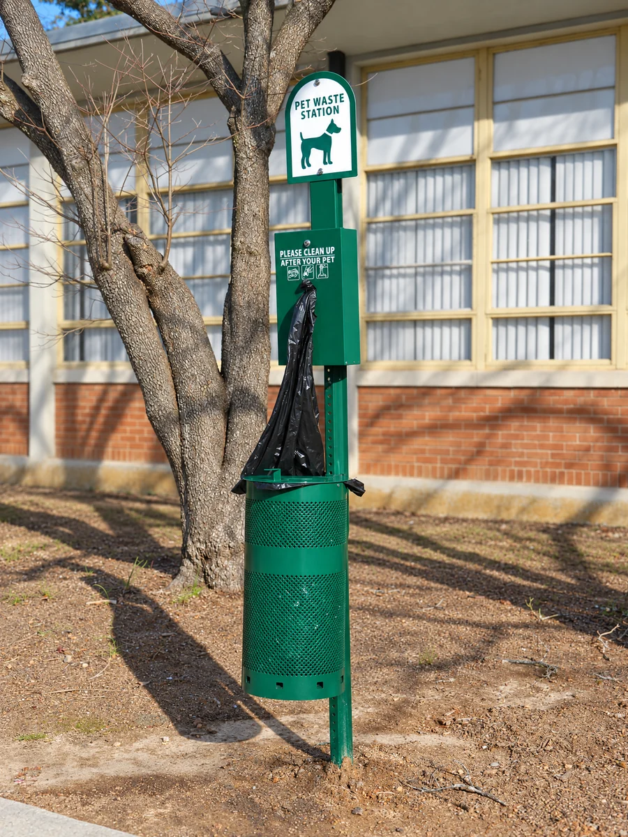 Illustrative green pet waste station; retouched from a licensed real photograph, not a K9 installation
